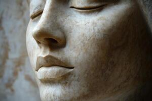 A close up of a marble statue with eyes closed photo