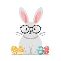 Cute rabbit with glasses surrounded by colorful decorated eggs in flat art vector