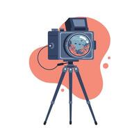 Vintage medium format camera mounted on tripod with detailed lens reflection of underwater coral and fish art design in orange background vector