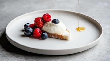 A single slice of farm bread with organic cream cheese and fresh summer berries. photo