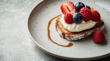 A single slice of fresh farm bread with organic cream cheese and summer berries. photo