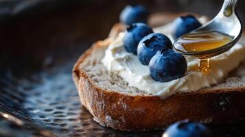 Close up of the fresh farm bread toast, cream cheese and a blueberries. photo