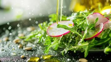 Close up of the fresh salad - dewdrops of lemon dressing clinging to a ruffled radish slice, pumpkin seeds caught onto a bed of peppery arugula. photo