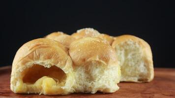 Homemade wheat bread with sesame seeds and cheese. black background photo