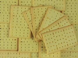 Stack of salted biscuits crackers top view photo