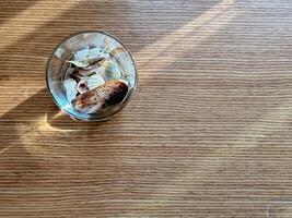 Copyspace with top view glass of shells on wood table photo