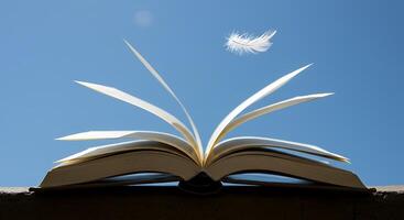 Open Book with Feather Floating, Knowledge Takes Flight photo