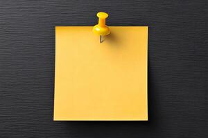 Bright yellow sticky note for mockup, pinned to a textured black surface, ready for reminders or messages in an office or home setting photo