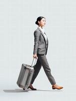 confident businesswoman in stylish suit walks with suitcase, showcasing professionalism and elegance. Her posture exudes determination and readiness for travel photo