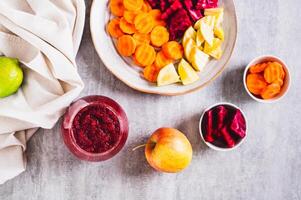ABC juice from beetroot, carrot and apple for detox in a glass on the table top view photo