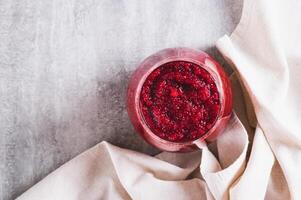 Close up of ABC juice from beetroot, carrot and apple for detox in a glass on the table top view photo