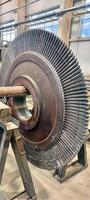 Industrial medium pressure turbine rotor stage in a workshop. Mechanical engineering. Power engineering. photo