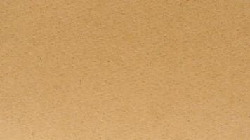 A brown paper texture background with a few small dots photo