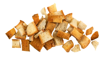 dry crispy bread crumbs scattered in pieces and bits on isolated background for food waste concept or culinary ingredient texture png