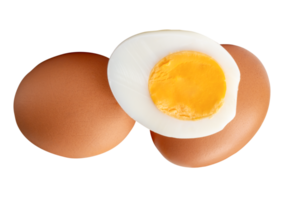 Chicken eggs and cooked or boiled chicken egg with egg yolk in half in stack isolated with clipping path in file format png