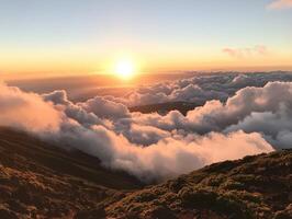 Sunrise above the clouds, casting a warm glow on the landscape, creating a serene and breathtaking view of nature's beauty. photo