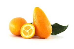 Fresh kumquats with leaf and a half fruit showing the pulp. photo