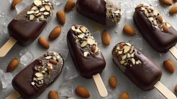 Chocolate Covered Ice Cream Bars with Almonds on Ice Cubes Overhead photo