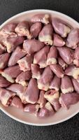 Chicken raw heart, red duck or turkey organs as an ingredient for dinner preparation video