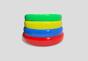 A stack of colorful rings on a gray background photo