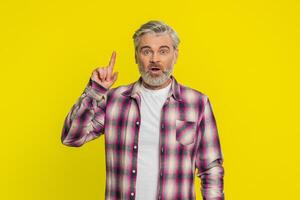 Inspired Caucasian man having good idea, plan startup, showing inspiration motivation Eureka gesture photo