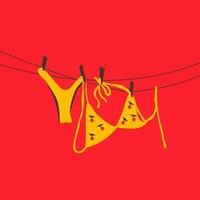 A yellow swimsuit with a playful cherry pattern hanging on a clothesline under the sun. vector