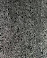 Wet concrete surface with raindrops texture, reflecting rainy season ambiance, suitable for construction projects and urban design inspiration photo