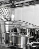 Stainless steel cookware set with whisks in modern kitchen, ideal for culinary arts and festive holiday cooking preparations photo