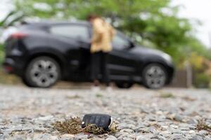 Lost keys on the ground, Car keys dropped on the floor or fall lying on the street home front. Walking Away From Lost Car Key, can not transport, express, rush time, wast time, emergency photo