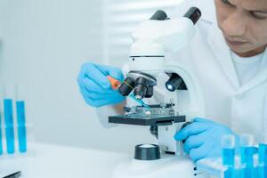 Scientist analyze biochemical samples in advanced scientific laboratory. Medical professional use microscope look microbiological developmental of viral. Biotechnology research in science photo