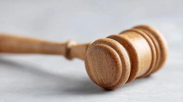 Wooden Judge is Gavel on Grey Background for Legal and Courtroom Themes photo