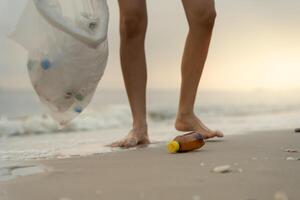 Save ocean. Volunteer pick up trash garbage at the beach and plastic bottles are difficult decompose prevent harm aquatic life. Earth, Environment, Greening planet, reduce global warming, Save world, photo