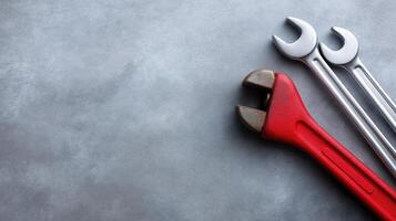 Professional Tools on a Grey Surface for Repair Projects and Mechanic Work Displayed in a Flat Lay Arrangement photo