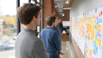 Team Collaborates on Brainstorming Session Using Sticky Notes for Idea Generation and Project Planning photo