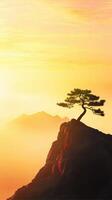 Surreal Silhouette of a Tree Against a Glowing Golden Sunset at the Beach photo
