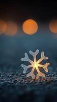 Close-Up of a Magical Frosted Snowflake Glowing Softly Against a Dark Background with Beautiful Bokeh photo