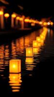 Serene Ancient Chinese Town Canal at Night Illuminated by Glowing Lanterns Reflecting on Water Surface photo