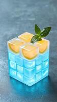 Refreshing Lemonade Drink with Glowing Ice Cubes and Lemon Garnish in a Stylish Glass photo