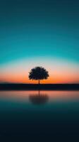 Serene Lonely Tree Glowing Under Dreamlike Sunset Sky with Reflection on Calm Water photo