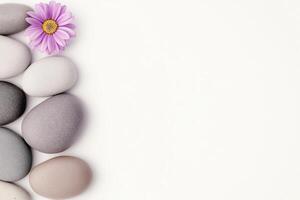 Tranquil Flatlay of Smooth Stones and Delicate Flower for Relaxation and Spa Therapy Ideas photo
