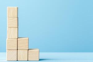 Wooden Blocks Forming a Progress Bar on a Soft Blue Background for Creative Visual Design photo