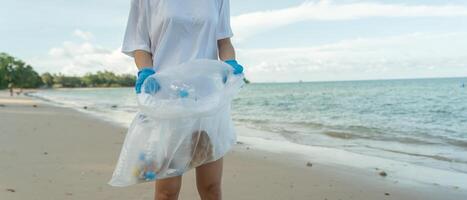 Save ocean. Volunteer pick up trash garbage at the beach and plastic bottles are difficult decompose prevent harm aquatic life. Earth, Environment, Greening planet, reduce global warming Save world photo