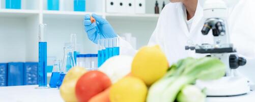 Scientist check chemical food residues in laboratory. Control experts inspect quality of fruits, vegetables. lab, hazards, ROHs, find prohibited substances, contaminate, Microscope Microbiologist photo