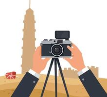 Hands holding camera on tripod capturing urban architecture with minimal flat style illustration vector