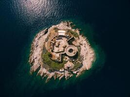 Aerial View of Abandoned Island Structures Surrounded by Water photo