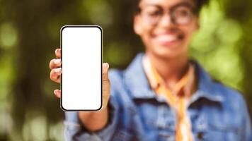 Unrecognizable Black Woman Showing Cellphone Empty Screen Recommending Application Standing Outdside. Shallow Depth, Mockup, Panorama photo