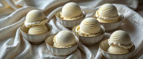Close up view of several scoops of rich creamy vanilla ice cream served in small bowls ready to be enjoyed as a refreshing indulgent dessert photo