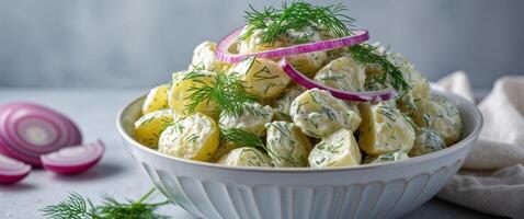 Serving of Potato Salad with Dill and Onion in a Bowl. photo