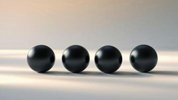 Four black round objects on a white surface photo