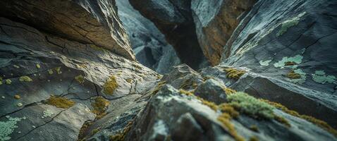 A rock formation with moss growing on it photo